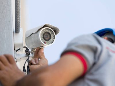 Security camera service man working.